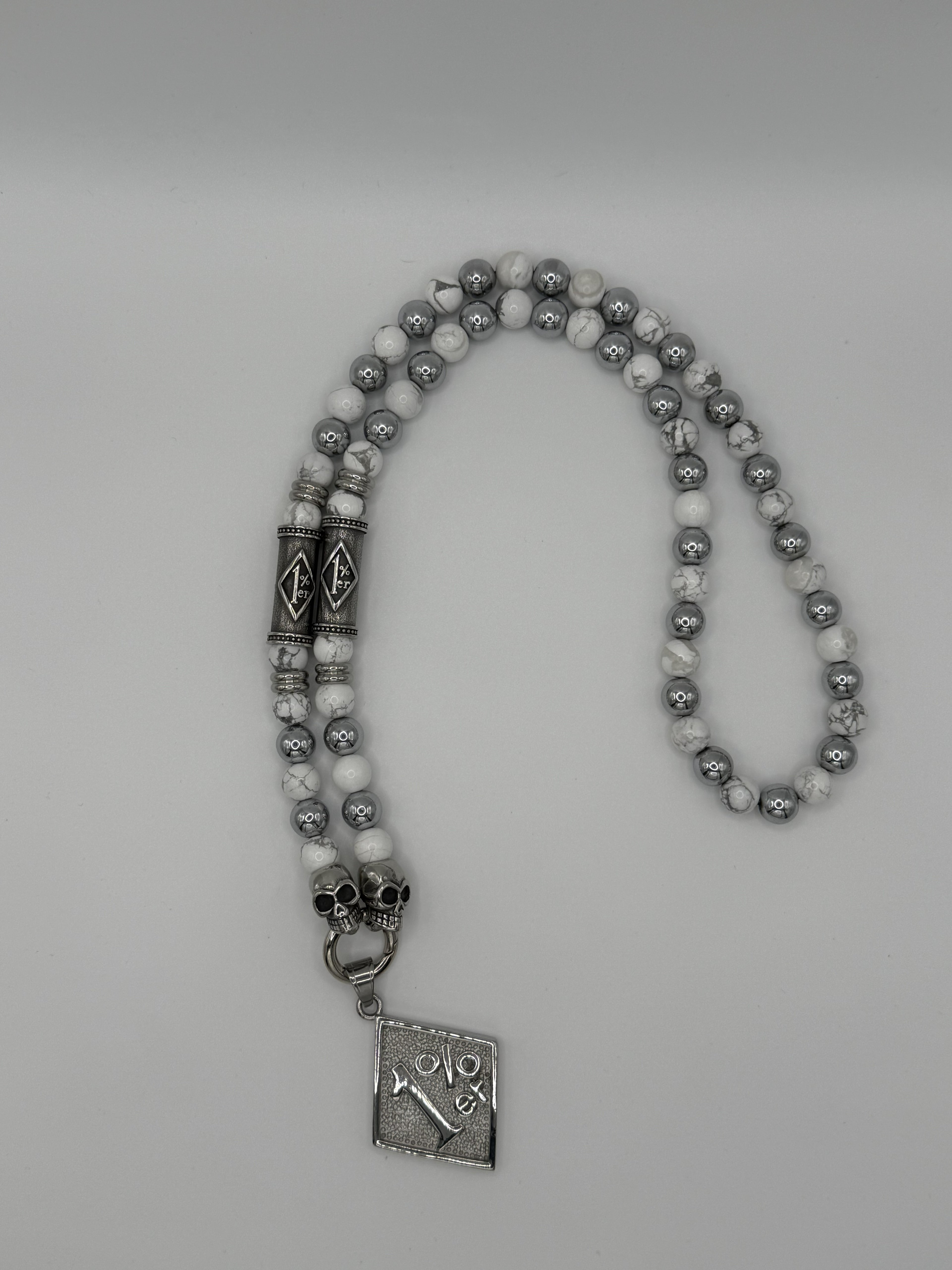 Kette mit 1 % er in silber